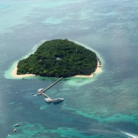 An island and its jetty seen from the scenic flight